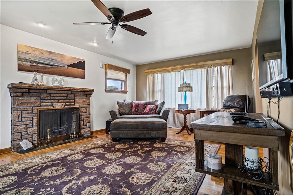 679 Mt Jackson Road New Castle, PA 16102 - Photo 5 of 14 a living room with furniture a fireplace and a flat screen tv
