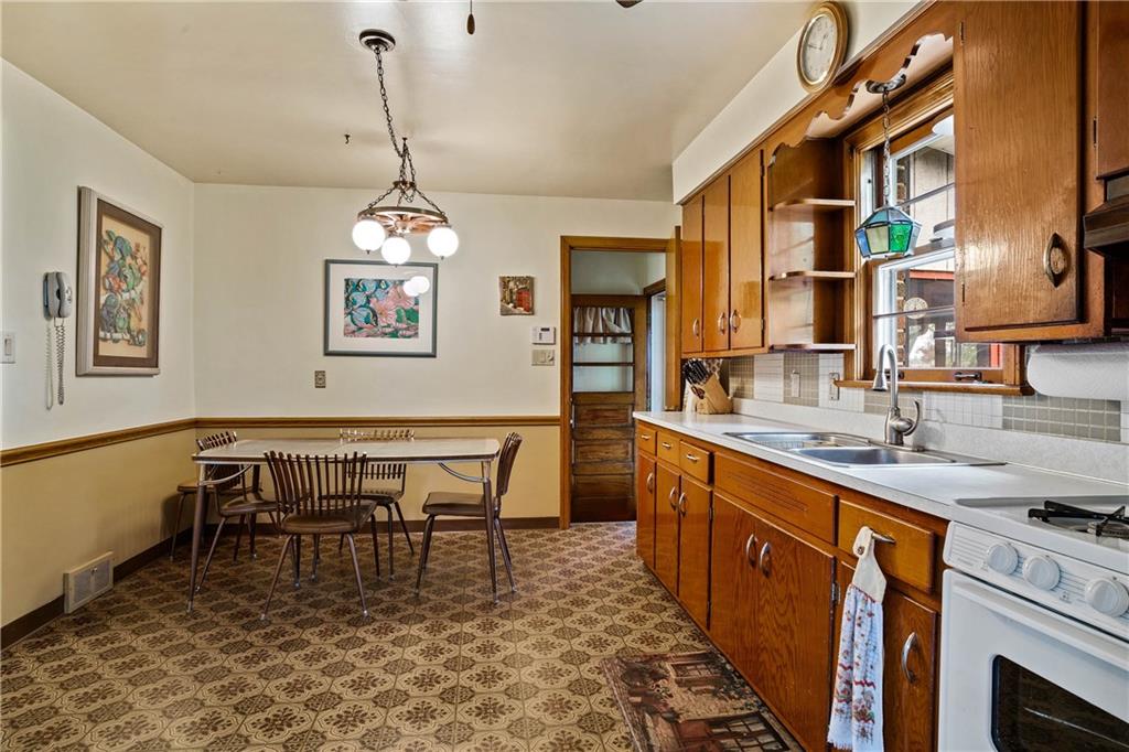 679 Mt Jackson Road New Castle, PA 16102 - Photo 6 of 14 a dining room with a table chairs and a chandelier