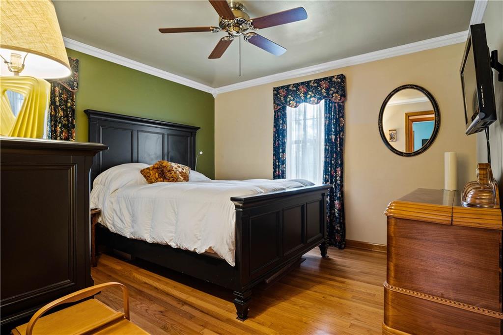 679 Mt Jackson Road New Castle, PA 16102 - Photo 8 of 14 a bed sitting in a bedroom next to a window