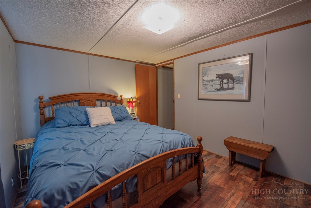 1848 West Mill Creek Road Warrensville, NC 28693 - Photo 36 of 50 a bedroom with a bed and a desk