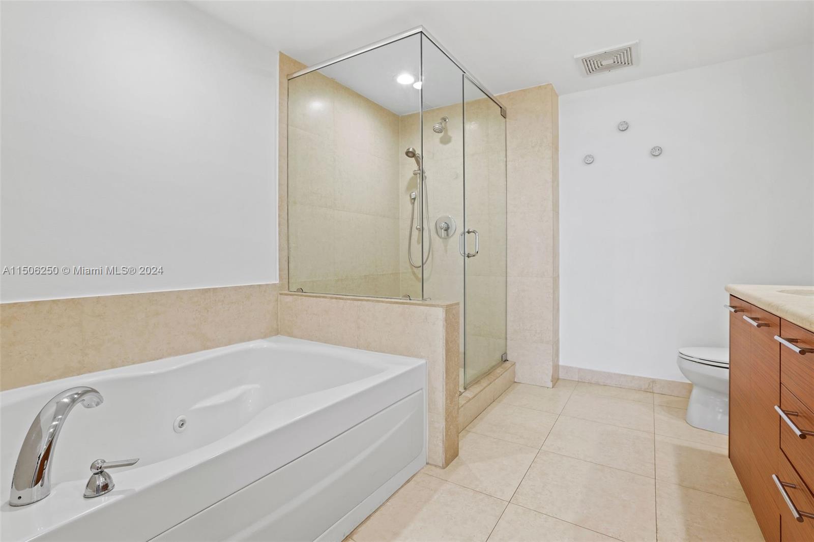 50 Biscayne Boulevard, Unit 3102 Miami, FL 33132 - Photo 19 of 43 a bathroom with a bathtub and a shower
