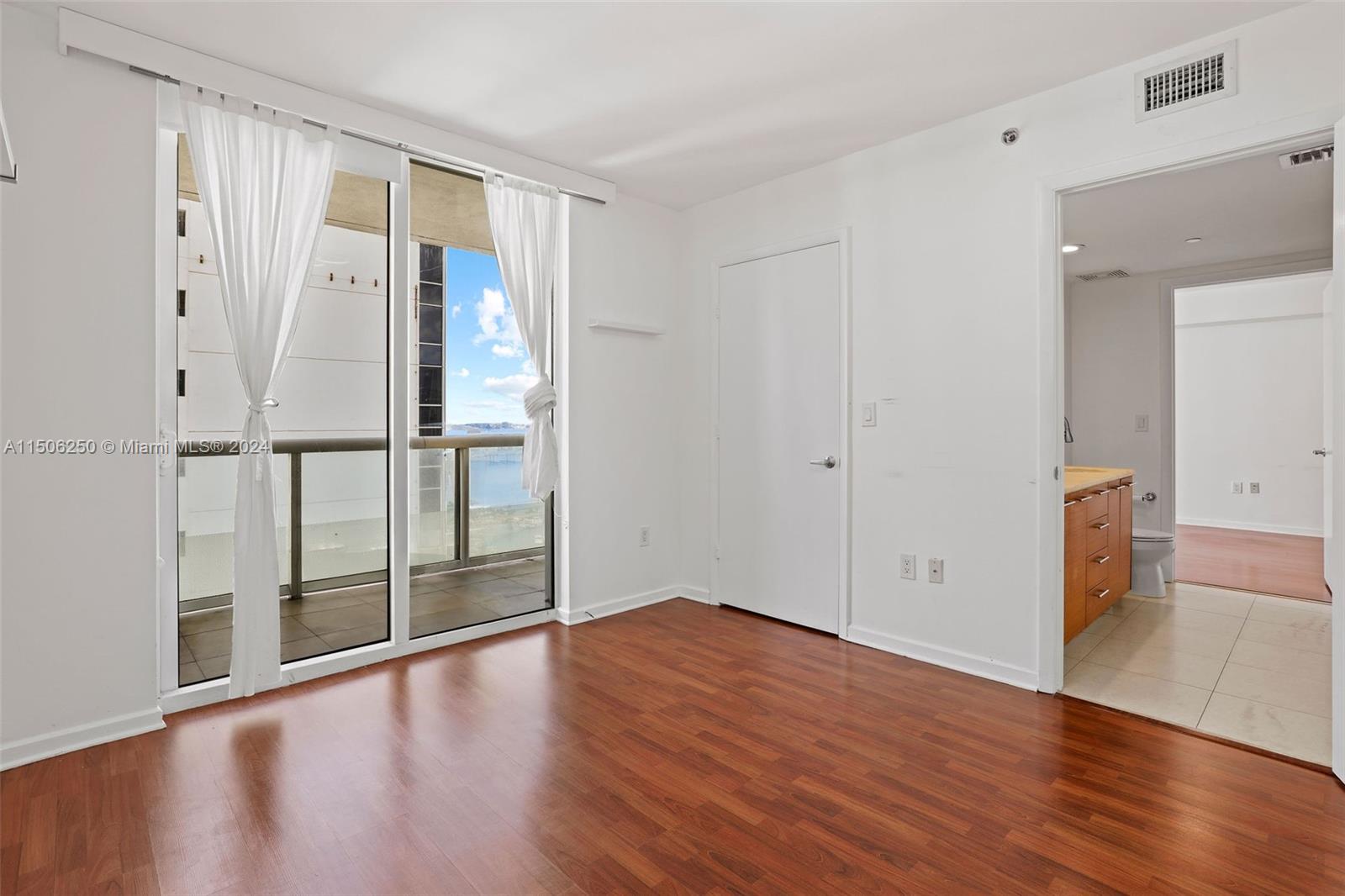 50 Biscayne Boulevard, Unit 3102 Miami, FL 33132 - Photo 21 of 43 wooden floor in an empty room