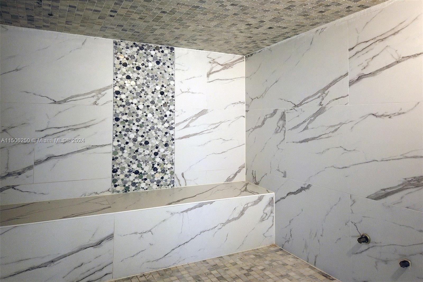 50 Biscayne Boulevard, Unit 3102 Miami, FL 33132 - Photo 38 of 43 a bathroom with a bathtub and shower