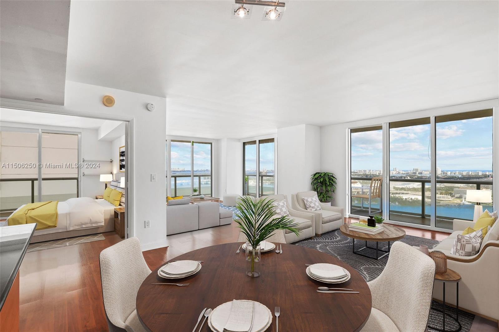 50 Biscayne Boulevard, Unit 3102 Miami, FL 33132 - Photo 4 of 43 a living room with furniture and a large window