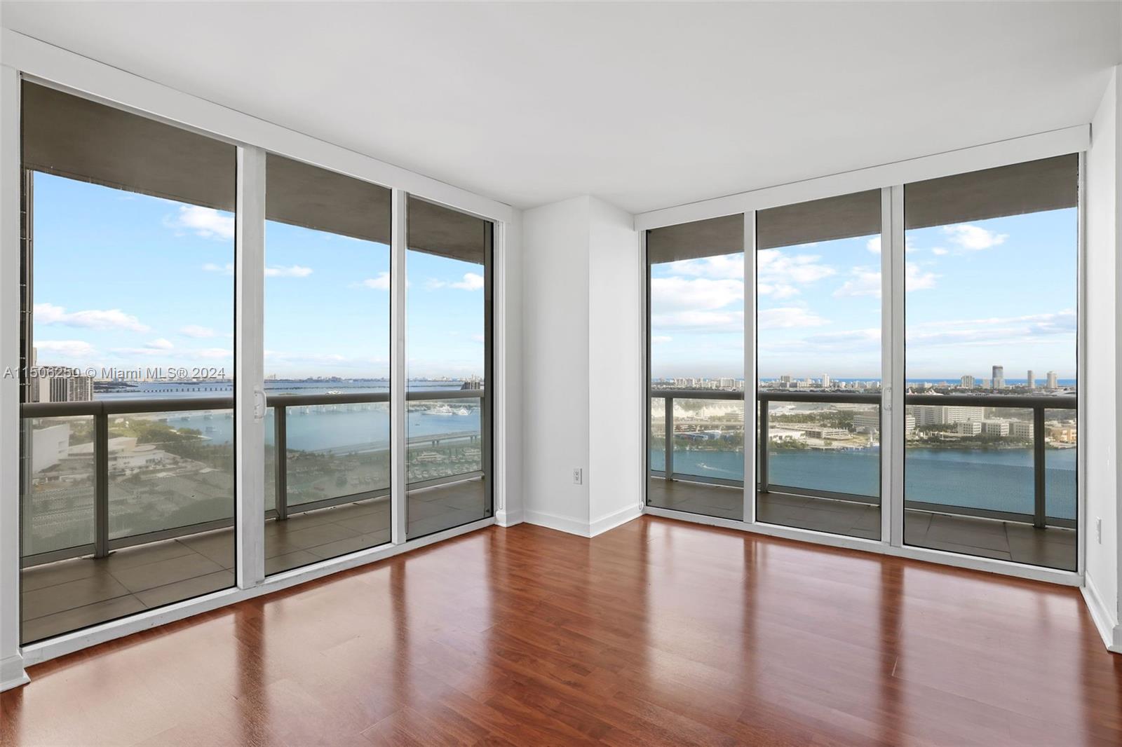 50 Biscayne Boulevard, Unit 3102 Miami, FL 33132 - Photo 7 of 43 a view of an empty room with wooden floor and walls