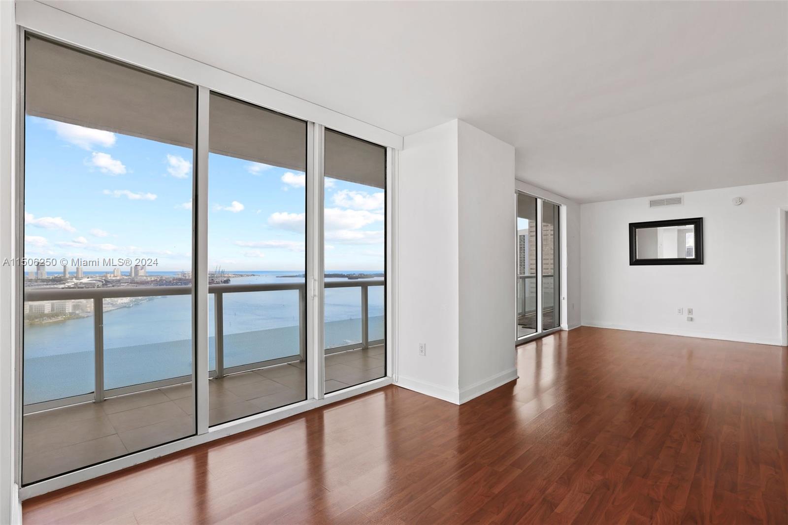 50 Biscayne Boulevard, Unit 3102 Miami, FL 33132 - Photo 9 of 43 a view of an empty room with glass door