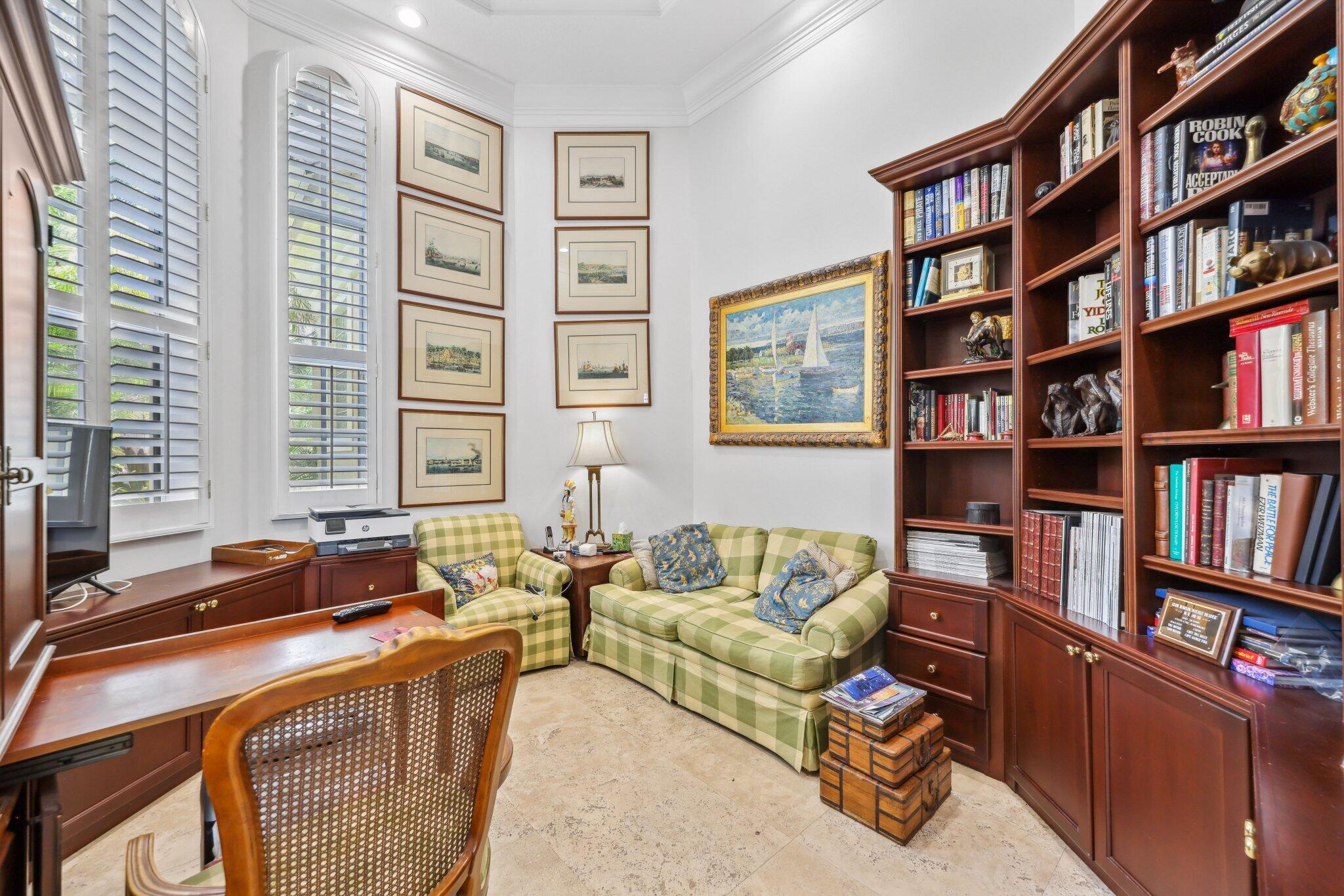 1018 Grand Court Highland Beach, FL 33487 - Photo 11 of 70 a living room with furniture and a book shelf