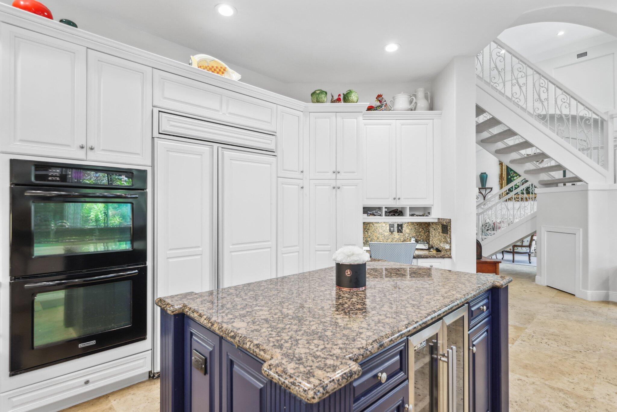 1018 Grand Court Highland Beach, FL 33487 - Photo 19 of 70 a kitchen with stainless steel appliances granite countertop a sink dishwasher and cabinets