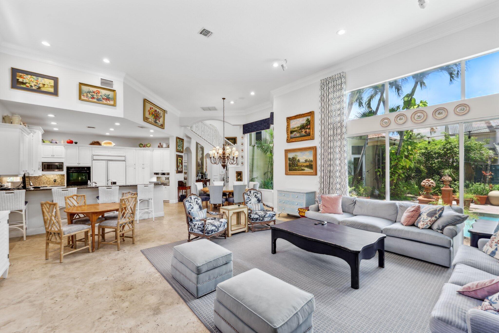 1018 Grand Court Highland Beach, FL 33487 - Photo 22 of 70 a living room with furniture and a large window