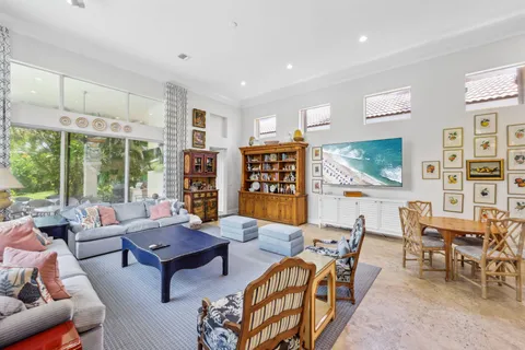 a view of a hallway with living room and furniture