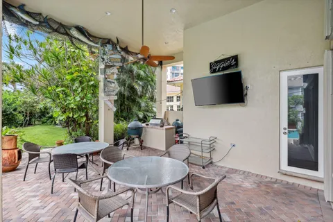 a bathroom with a granite countertop sink and a large mirror