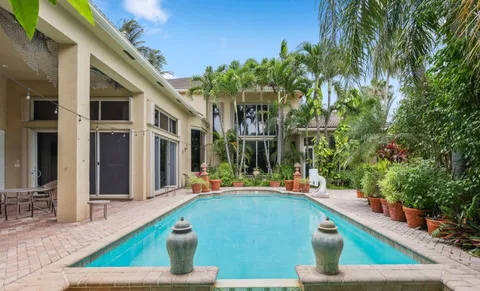 a bedroom with a bed and ceiling fan