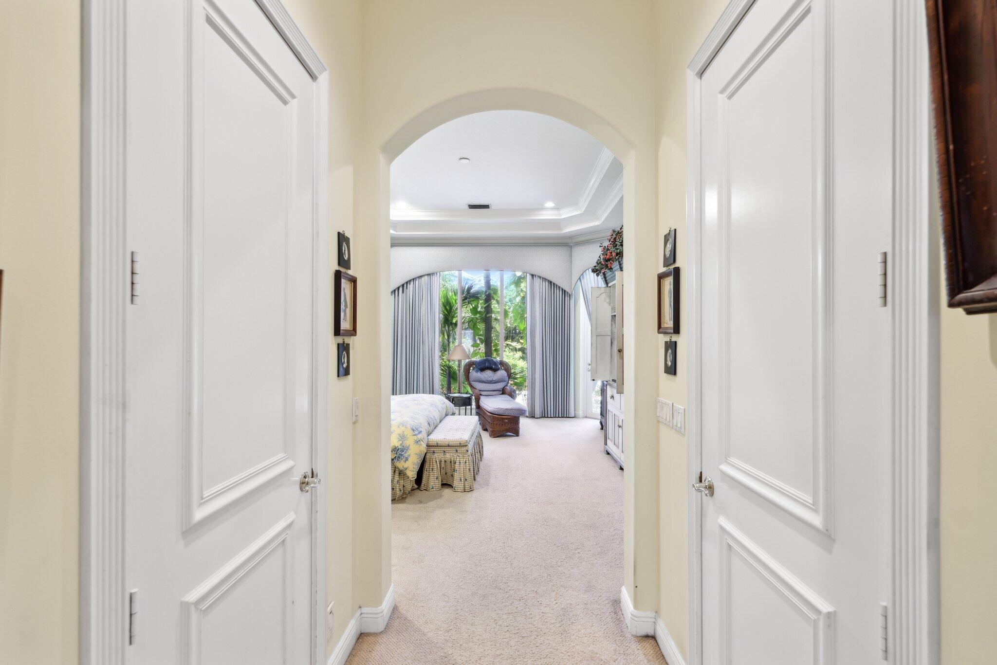 1018 Grand Court Highland Beach, FL 33487 - Photo 35 of 70 a view of a hallway with living room and furniture