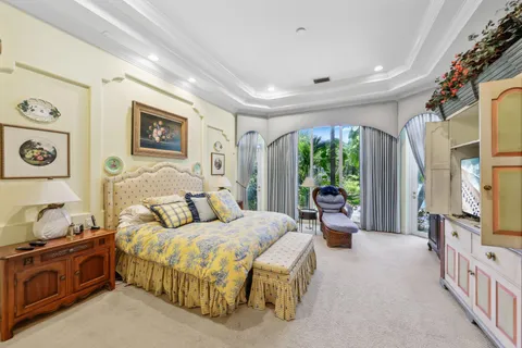 a bedroom with a bed and a dresser in it