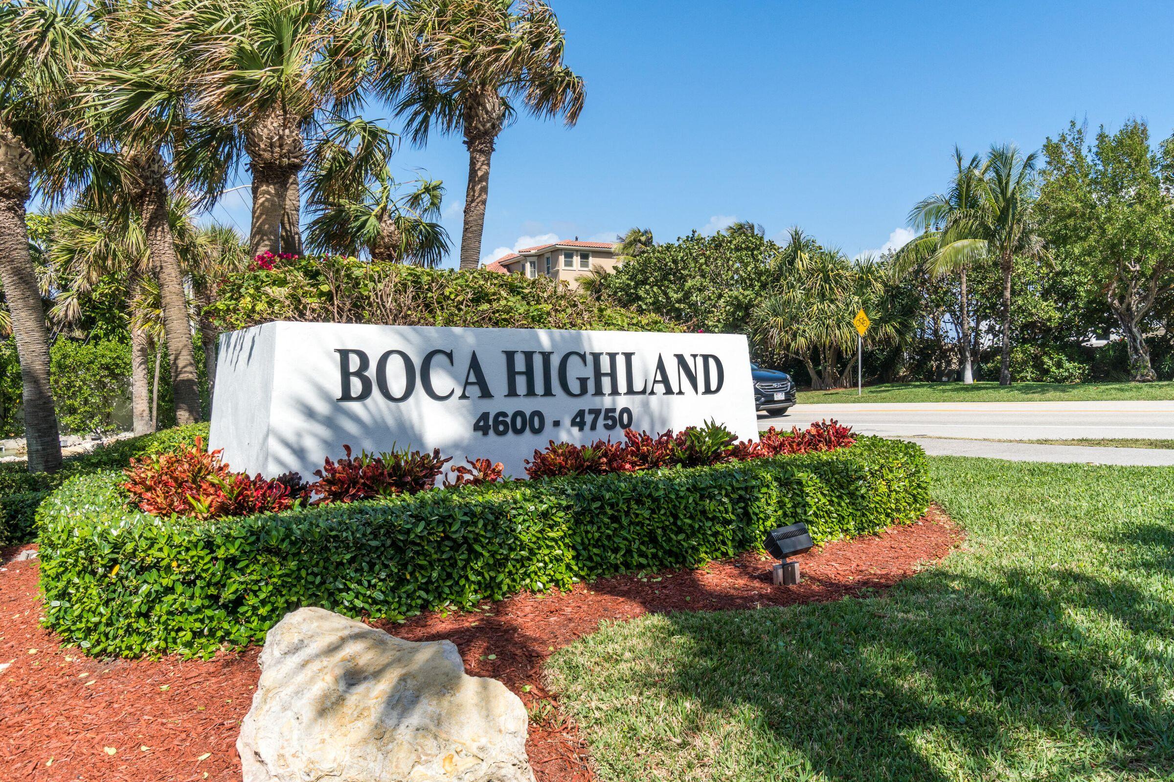 1018 Grand Court Highland Beach, FL 33487 - Photo 4 of 70 a view of a sign in a yard with potted plants and tree
