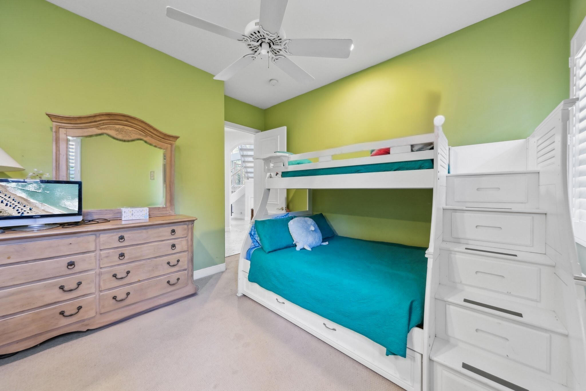 1018 Grand Court Highland Beach, FL 33487 - Photo 42 of 70 a bedroom with a bed and a dresser