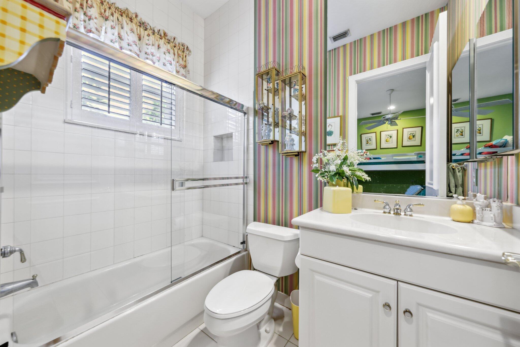 1018 Grand Court Highland Beach, FL 33487 - Photo 43 of 70 a bathroom with a sink toilet and shower