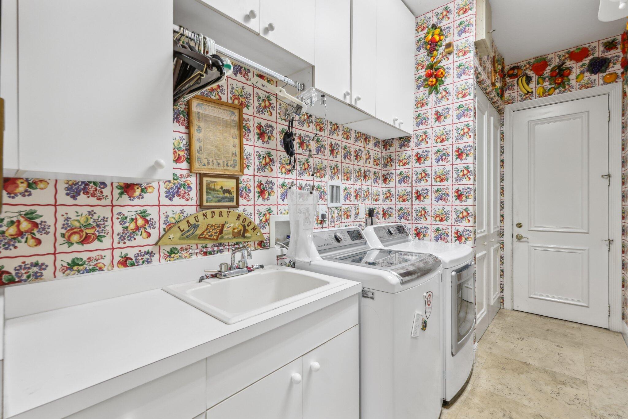 1018 Grand Court Highland Beach, FL 33487 - Photo 44 of 70 a bathroom with a sink and a shower curtain