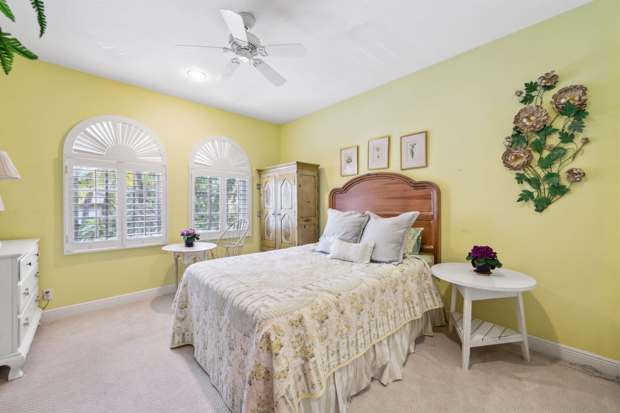 1018 Grand Court Highland Beach, FL 33487 - Photo 51 of 70 a bedroom with a bed and a painting on the wall