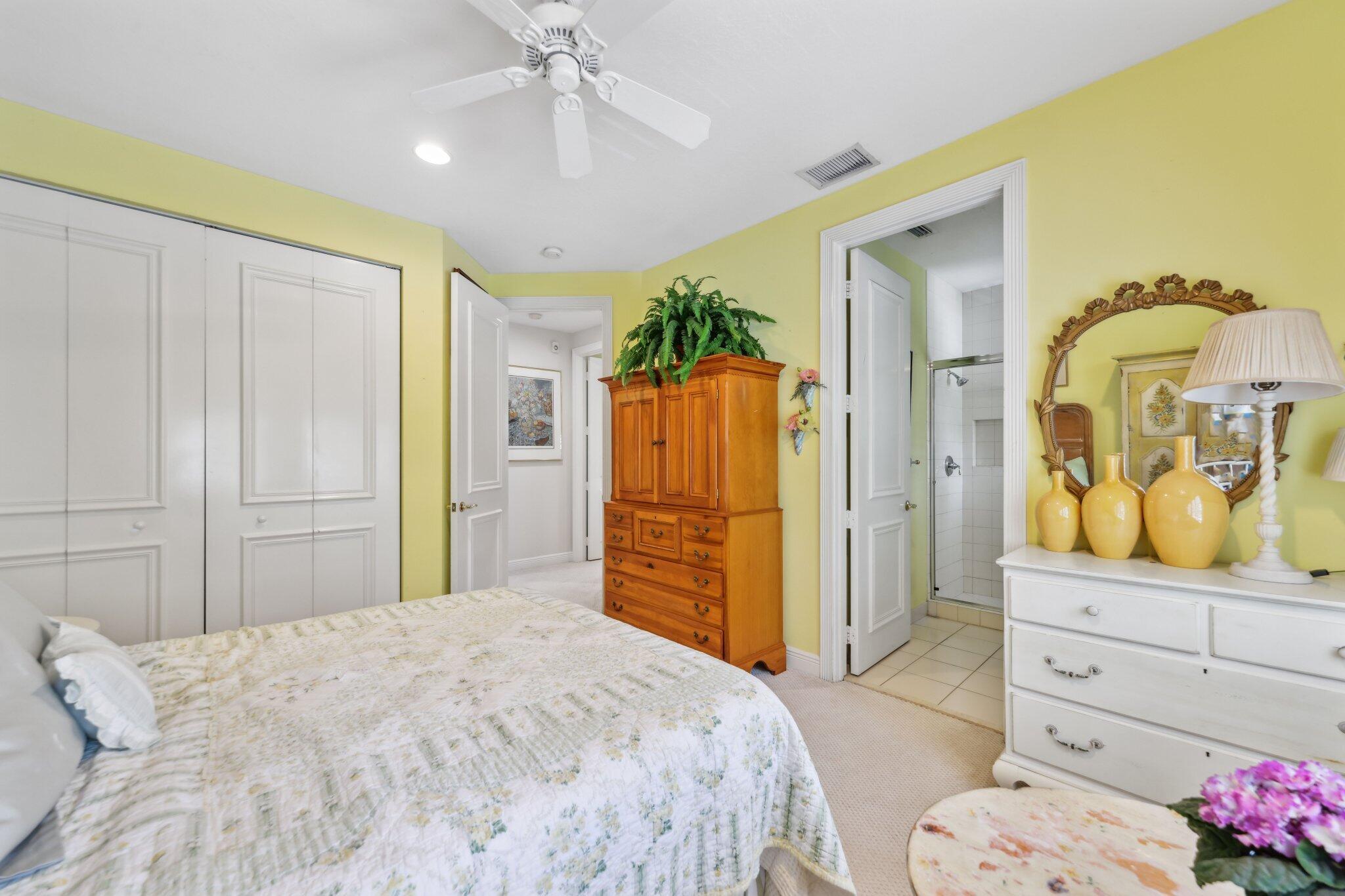 1018 Grand Court Highland Beach, FL 33487 - Photo 53 of 70 a bedroom with a bed and a dresser in it