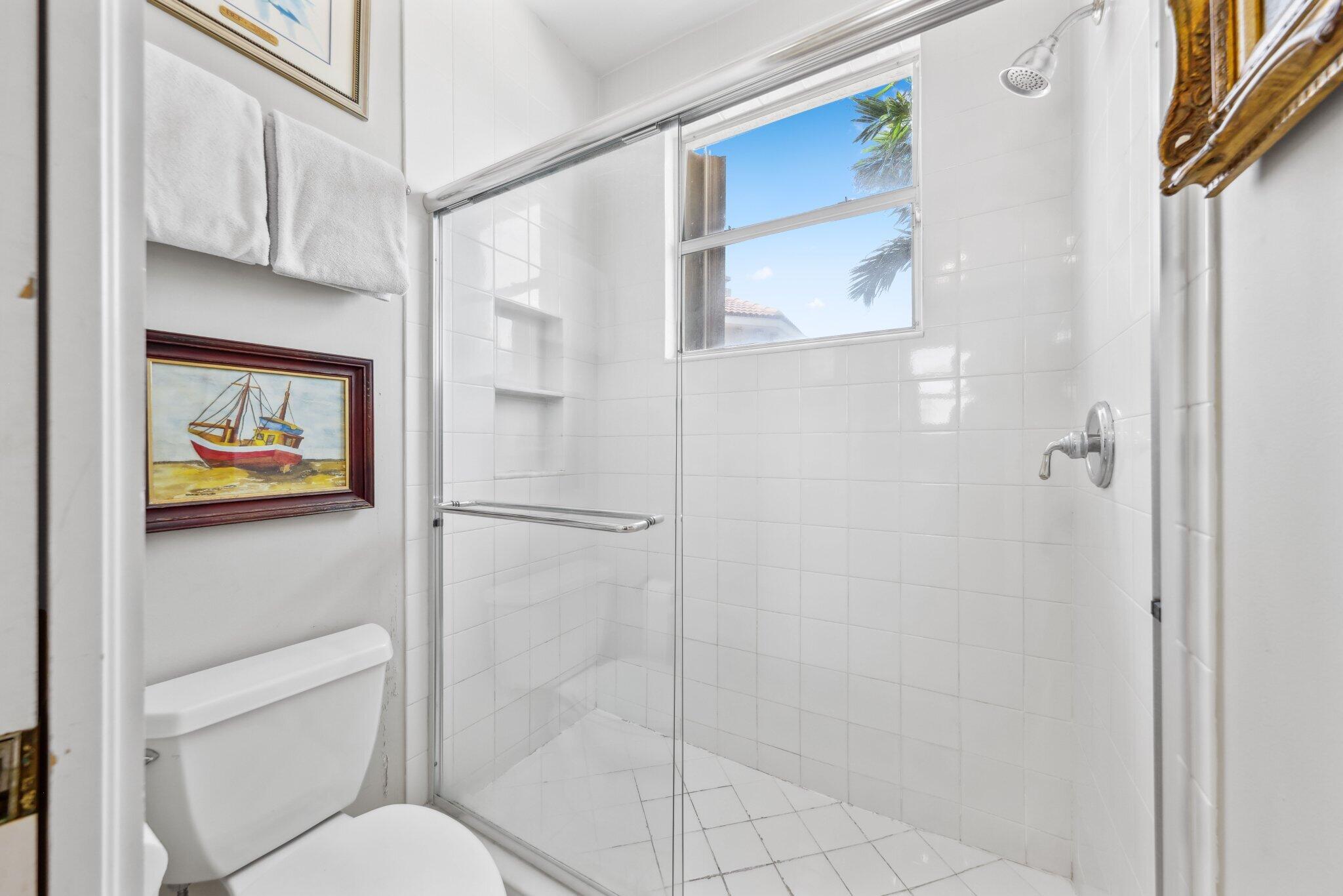 1018 Grand Court Highland Beach, FL 33487 - Photo 56 of 70 a bathroom with a toilet and a shower