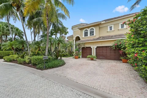 a living room with patio furniture and a large window