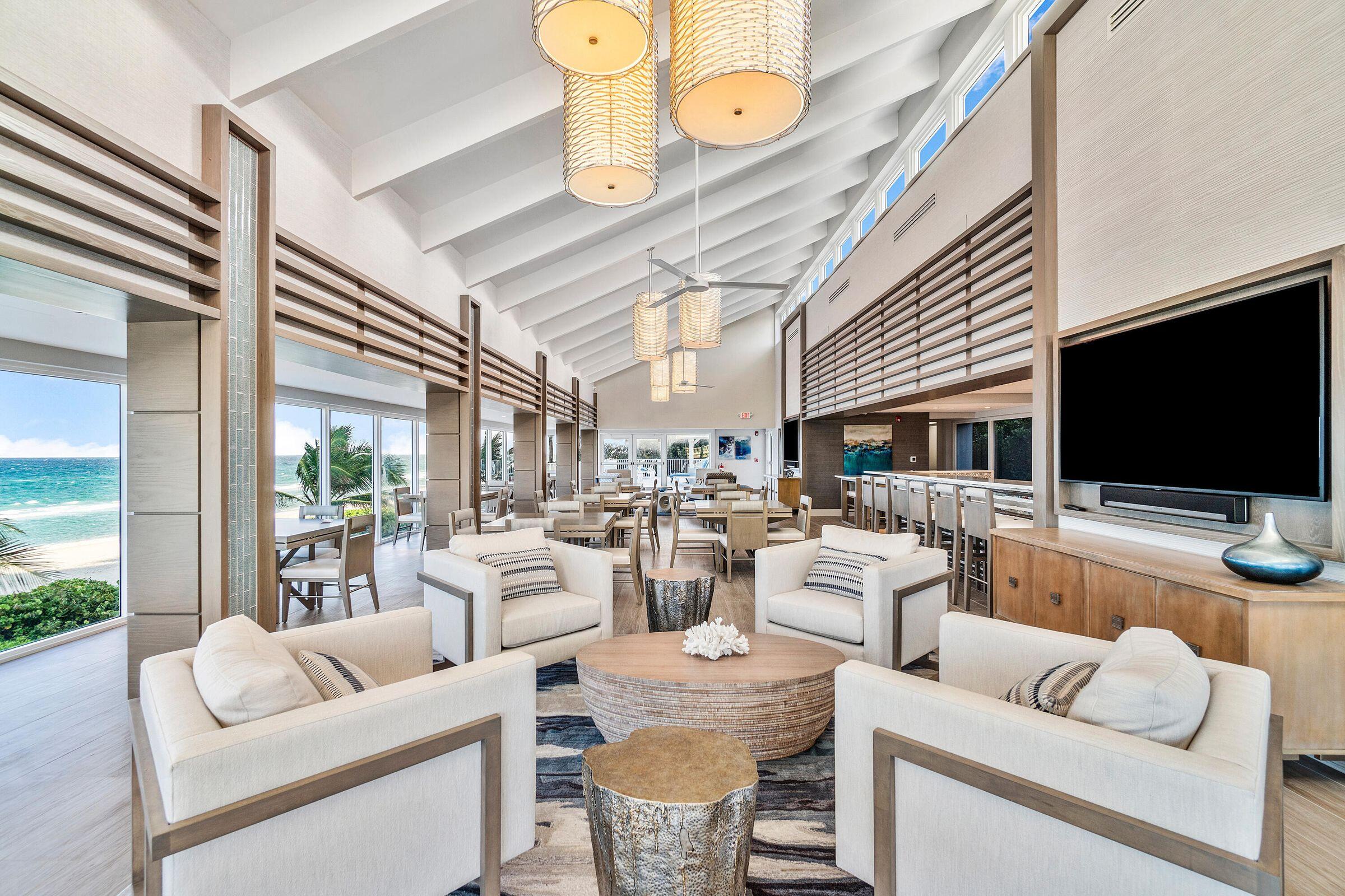 1018 Grand Court Highland Beach, FL 33487 - Photo 65 of 70 a living room with furniture and a flat screen tv