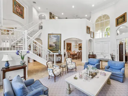 a large kitchen with a table and chairs