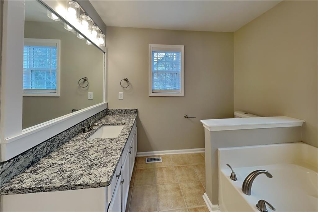 85 Ellen Glen Way Dallas, GA 30132 - Photo 11 of 21 a bathroom with a sink and a toilet