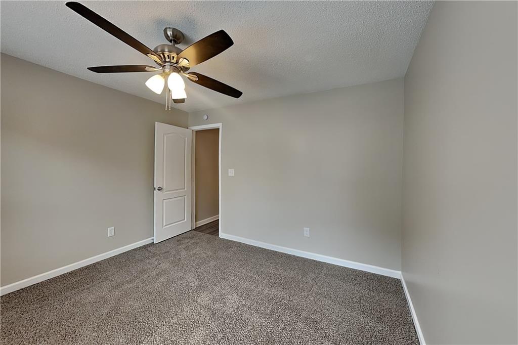 85 Ellen Glen Way Dallas, GA 30132 - Photo 15 of 21 an empty room with a window and a fan
