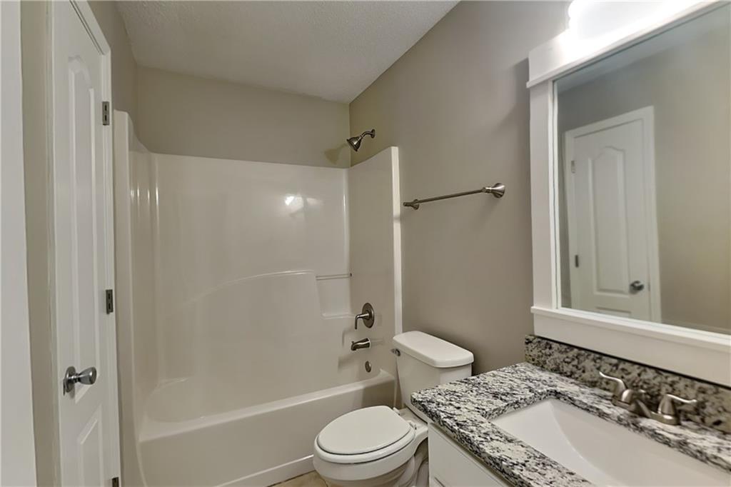 85 Ellen Glen Way Dallas, GA 30132 - Photo 19 of 21 a bathroom with a sink toilet and shower