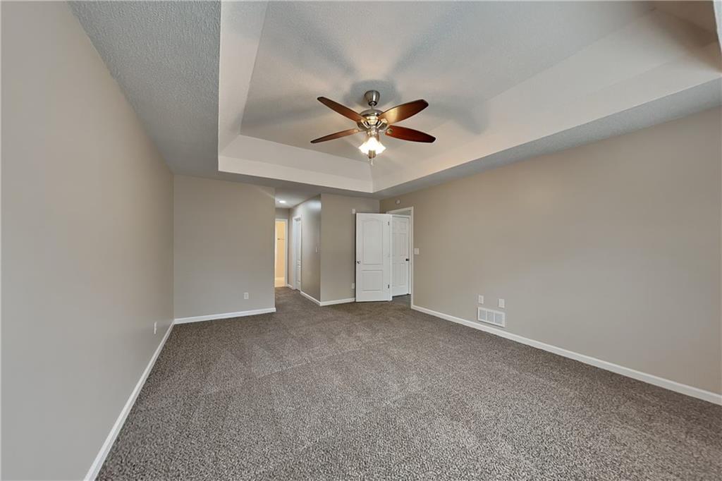 85 Ellen Glen Way Dallas, GA 30132 - Photo 8 of 21 an empty room with closet and a ceiling fan