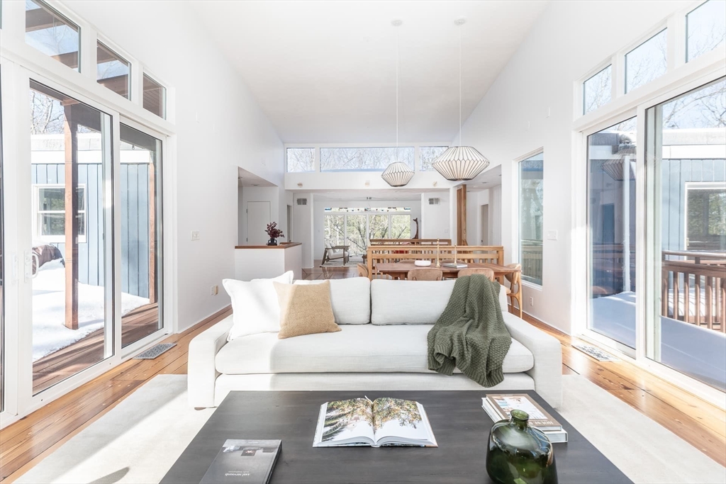 100 Bradford Road Weston, MA 02493 - Photo 13 of 42 a living room with furniture and a large window