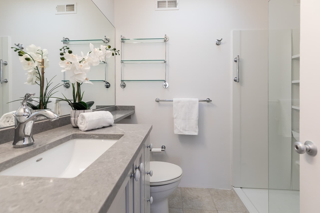 100 Bradford Road Weston, MA 02493 - Photo 25 of 42 a bathroom with a sink toilet and shower