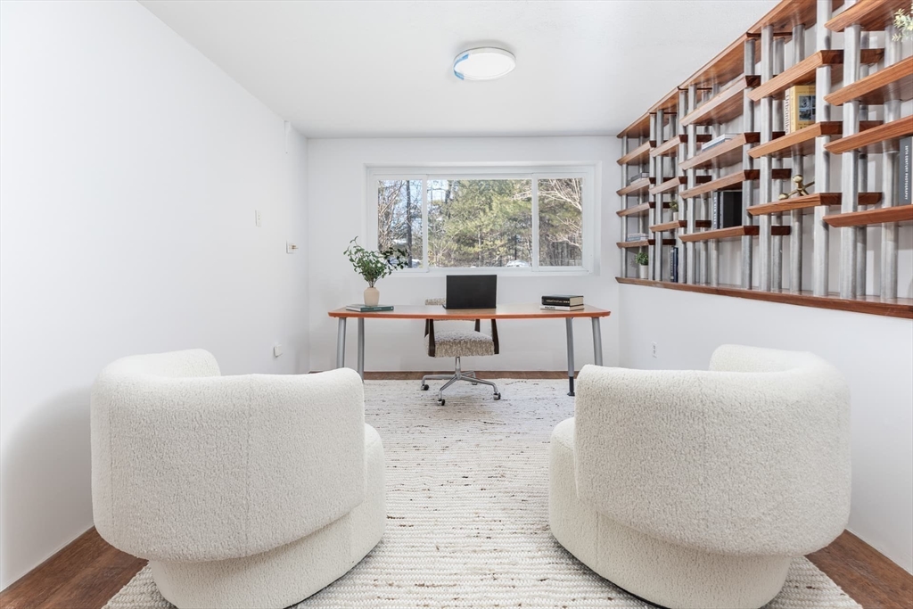 100 Bradford Road Weston, MA 02493 - Photo 28 of 42 a living room with furniture and a large window
