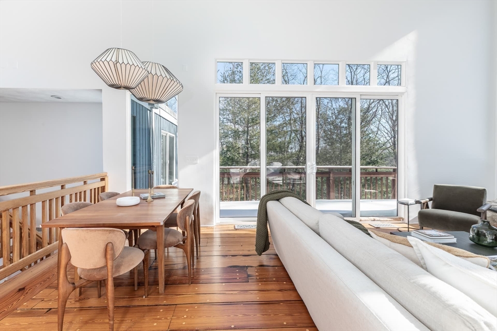 100 Bradford Road Weston, MA 02493 - Photo 10 of 42 a living room with furniture a table and a large window