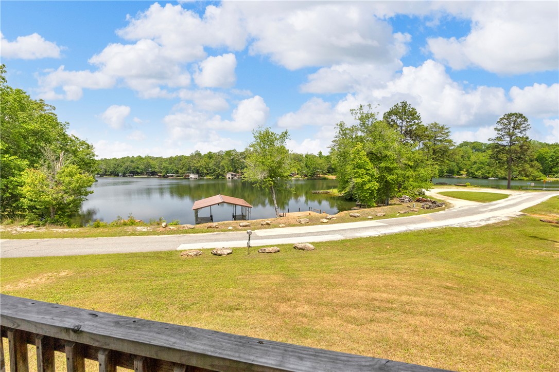334 Lake Becky Road Mountain Rest, SC 29664 - Photo 27 of 46 A tranquil lake view property features a private boat dock and verdant surroundings.