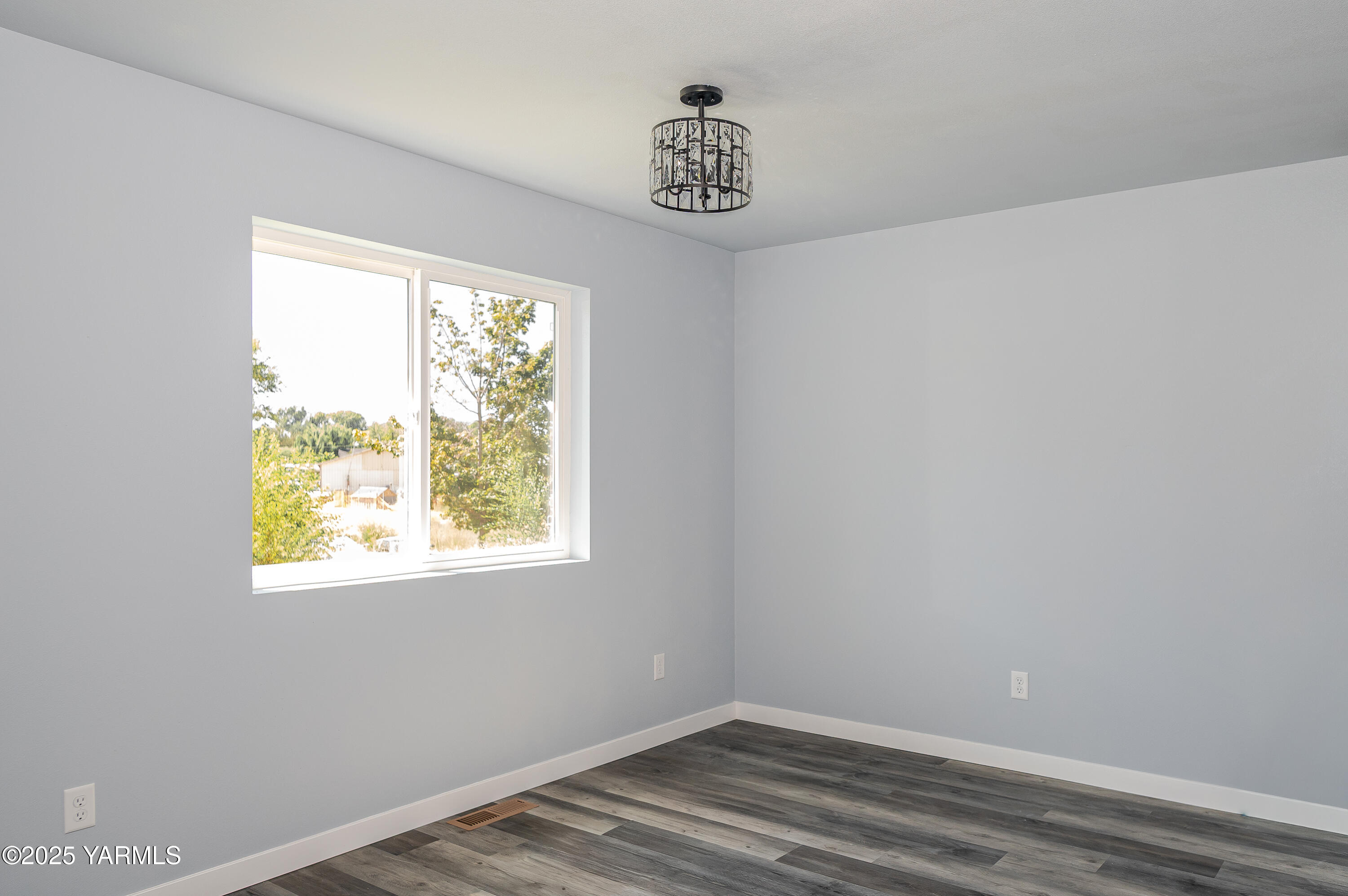 213 3rd Street East Granger, WA 98932 - Photo 5 of 12 a view of empty room with window