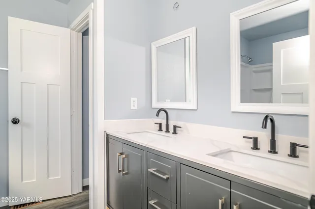 a bathroom with a sink and a mirror