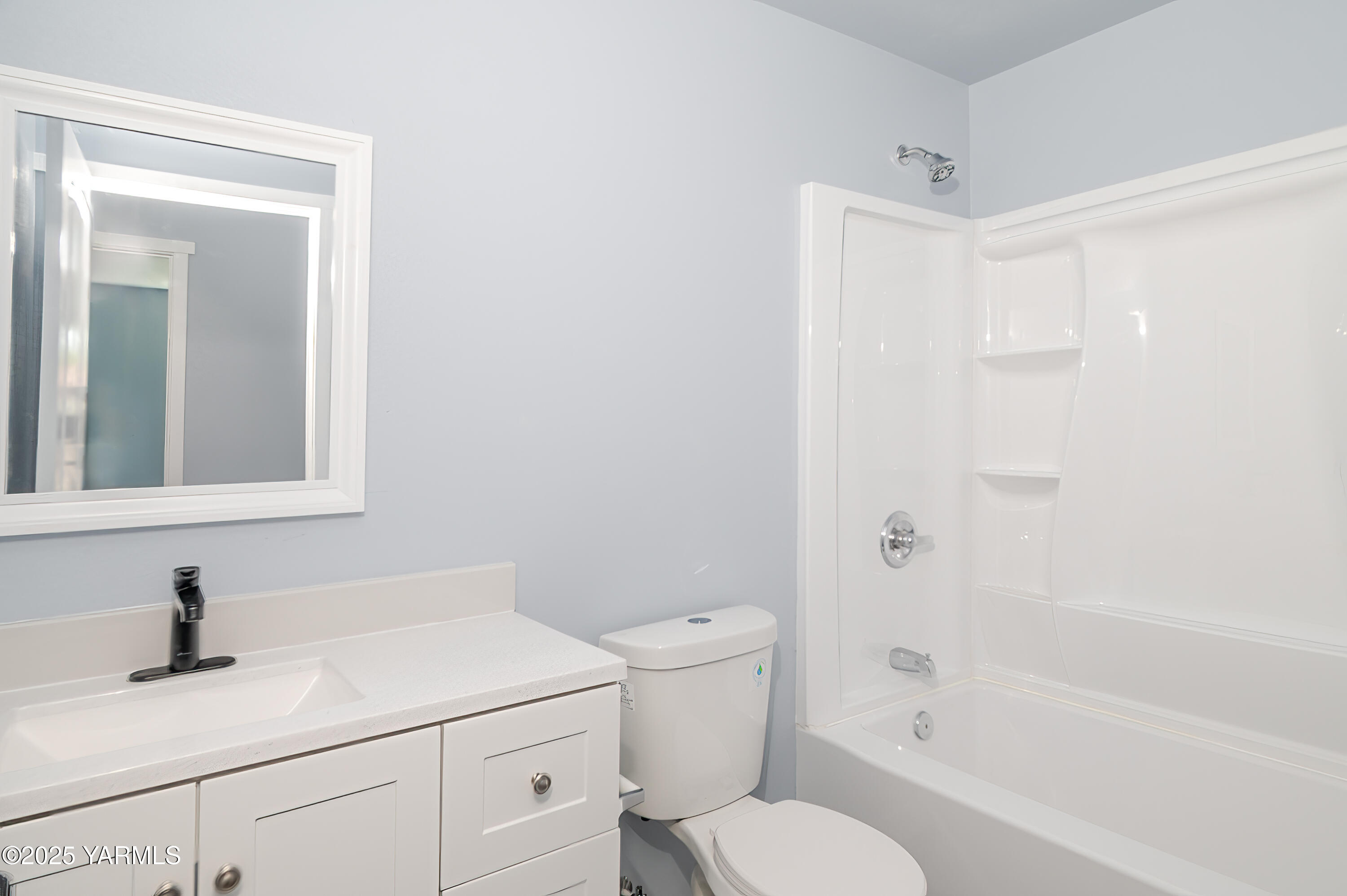 213 3rd Street East Granger, WA 98932 - Photo 10 of 12 a bathroom with a sink a toilet and shower