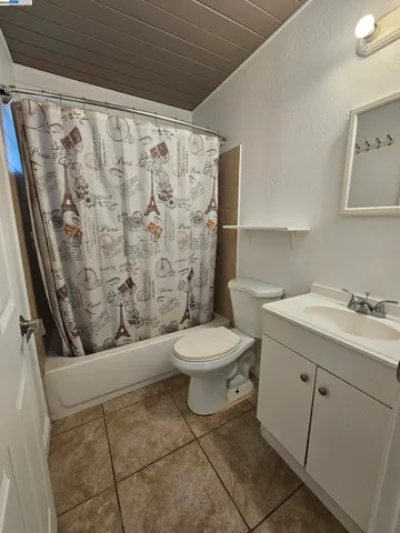 a bathroom with a toilet a sink and a shower