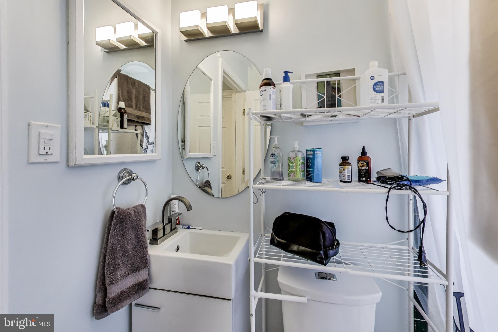 10146 Dallas Avenue Silver Spring, MD 20901 - Photo 15 of 25 a bathroom with a sink and a mirror