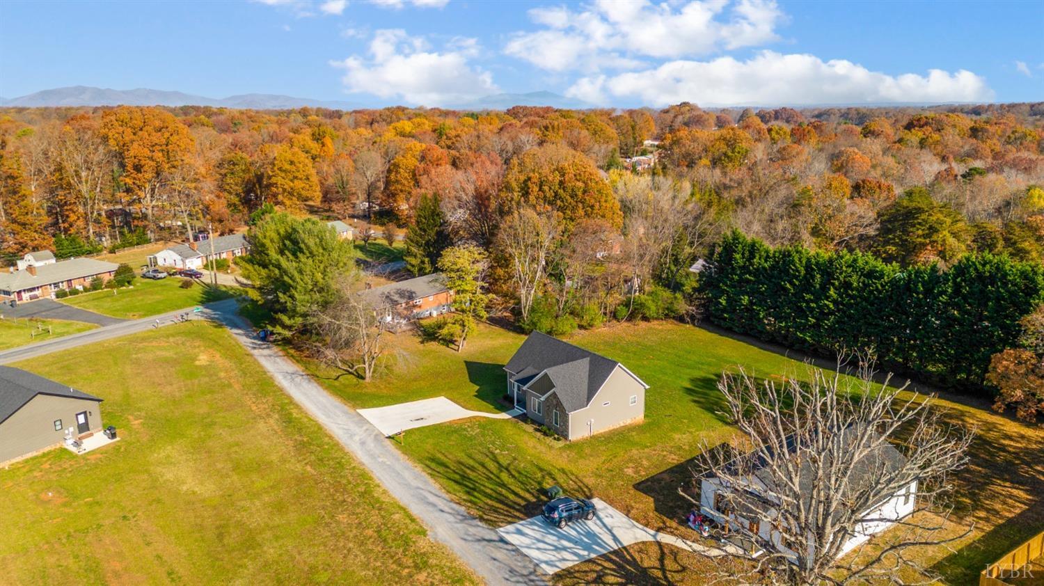 a view of a swimming pool with an outdoor seating and a yard