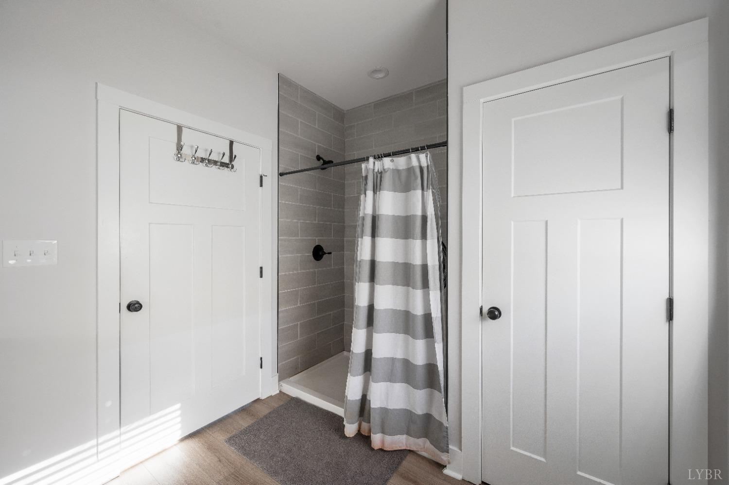 36 Porter Lane Forest, VA 24551 - Photo 12 of 25 a bathroom with a glass shower door