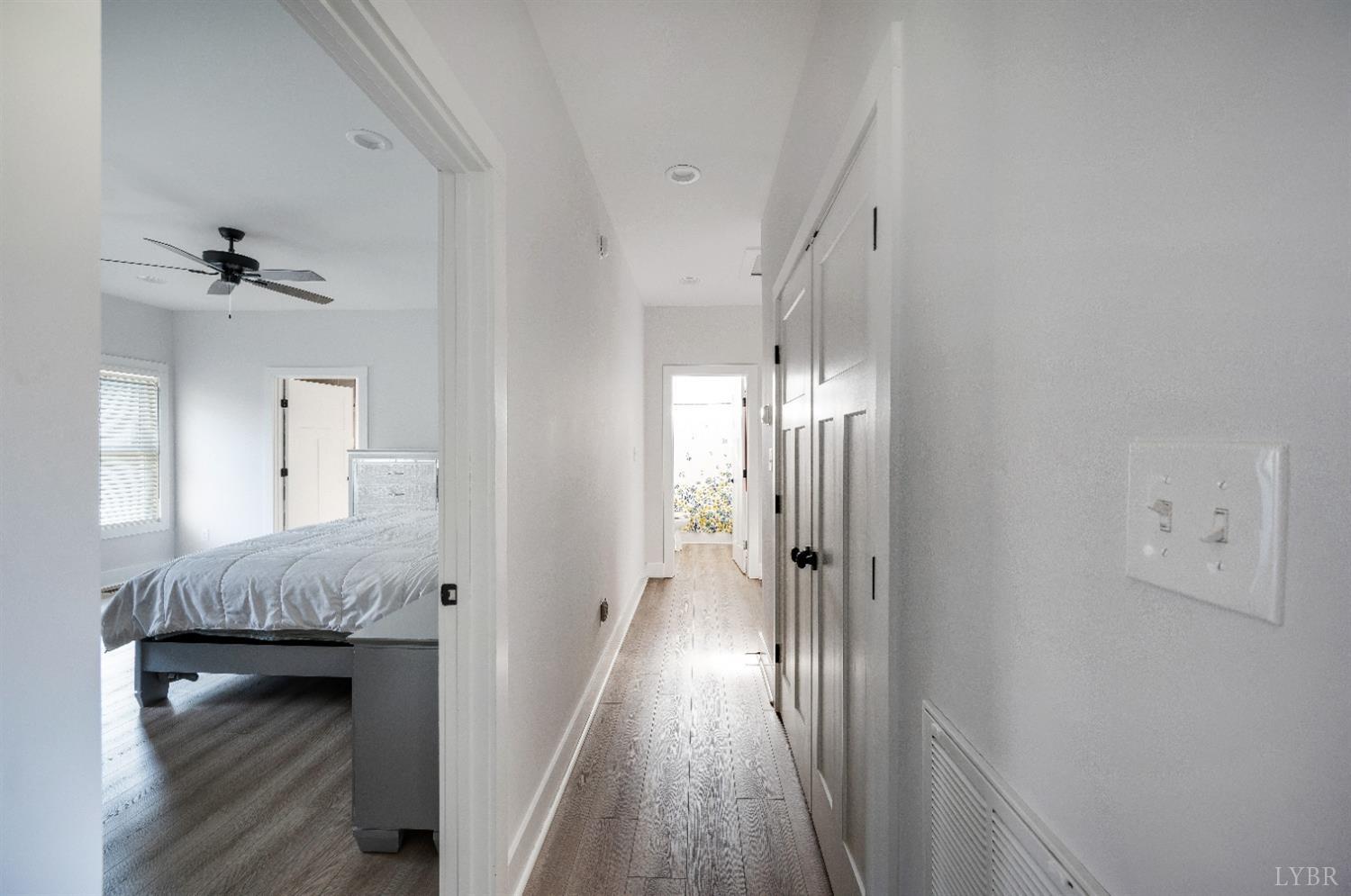 36 Porter Lane Forest, VA 24551 - Photo 14 of 25 a view of a hallway with wooden floor and staircase