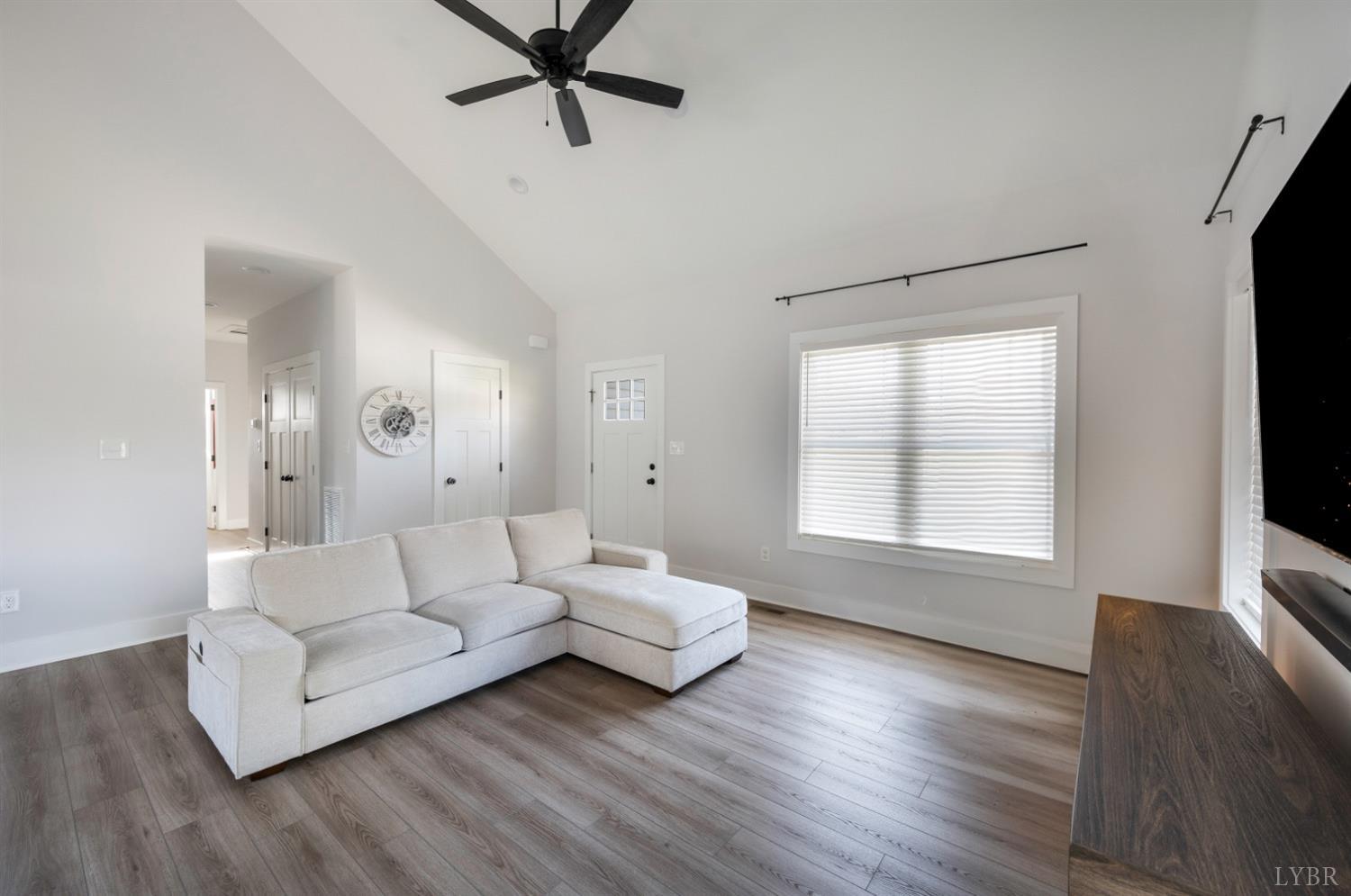 36 Porter Lane Forest, VA 24551 - Photo 6 of 25 a living room with couches and a flat screen tv with wooden floor