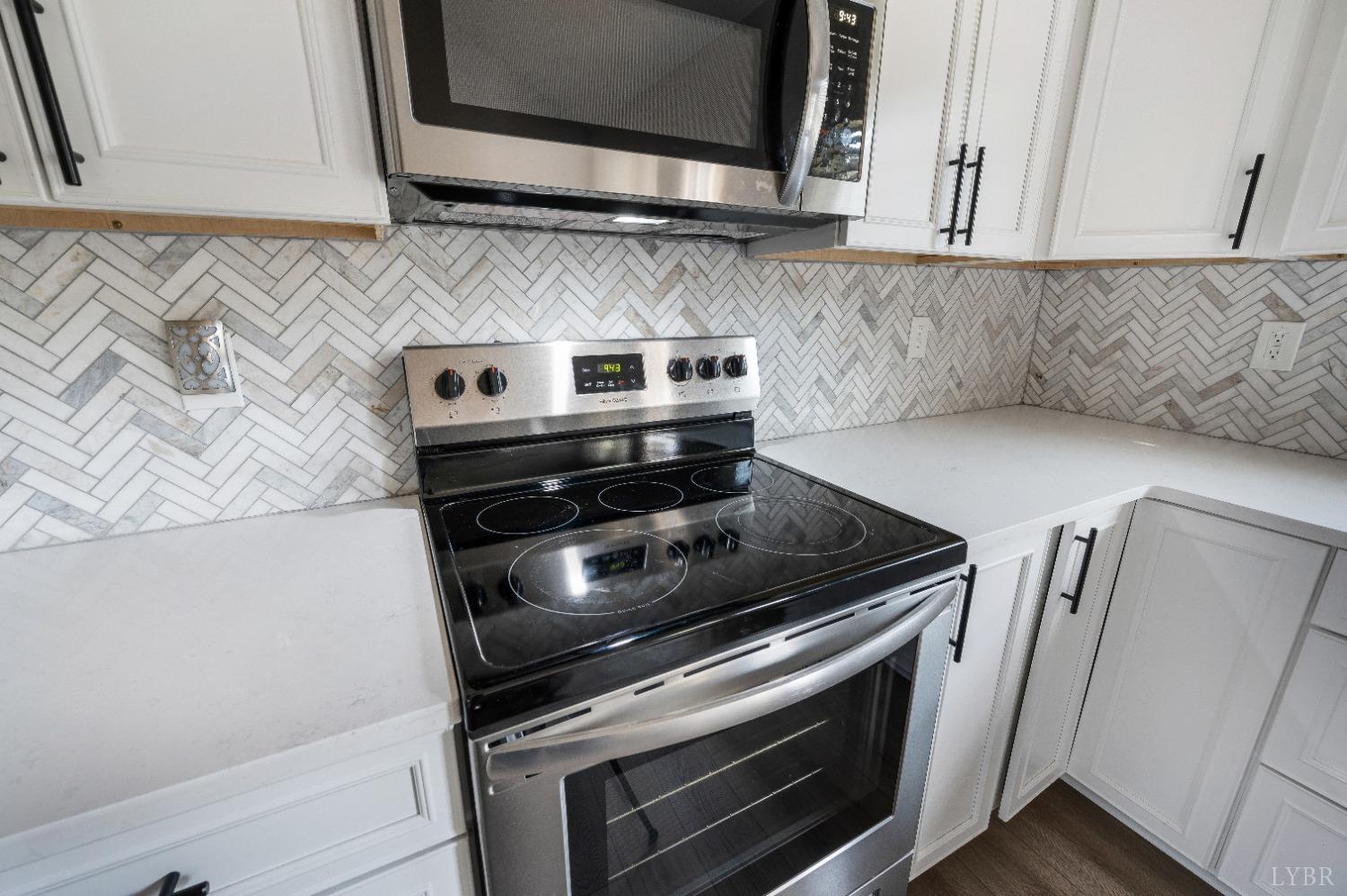 36 Porter Lane Forest, VA 24551 - Photo 8 of 25 a stove top oven sitting inside of a kitchen