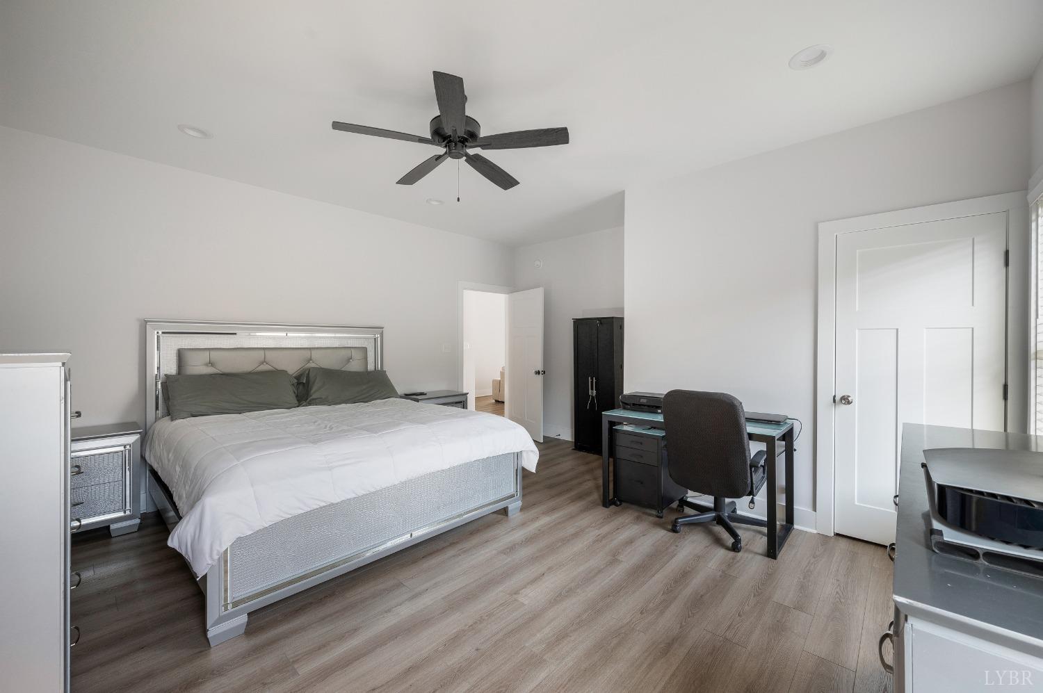 36 Porter Lane Forest, VA 24551 - Photo 10 of 25 a bedroom with a bed a chair and a potted plant on a dresser