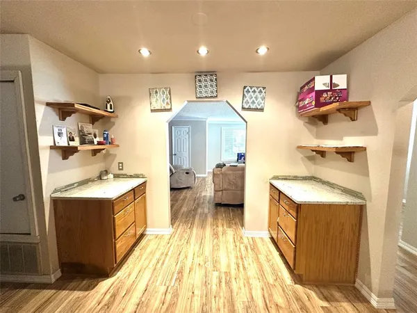a kitchen with a stove and a refrigerator