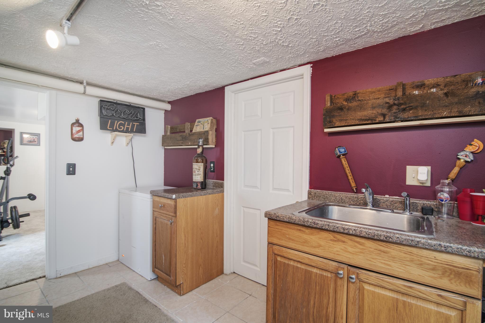 11306 Sword Road Williamsport, MD 21795 - Photo 17 of 30 a kitchen with a sink and cabinets